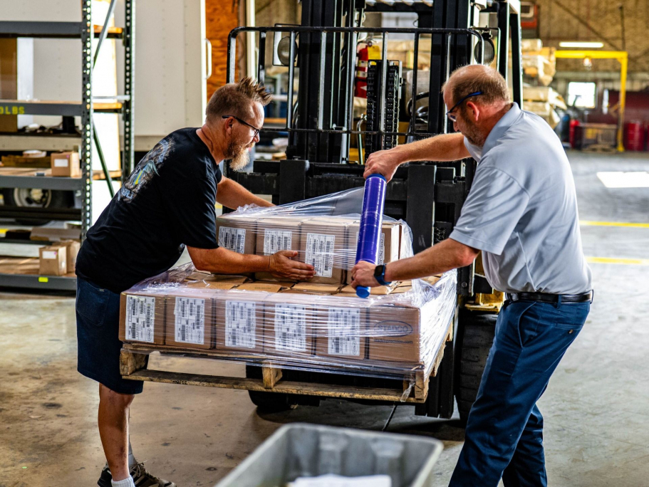 Employees wrapping boxes